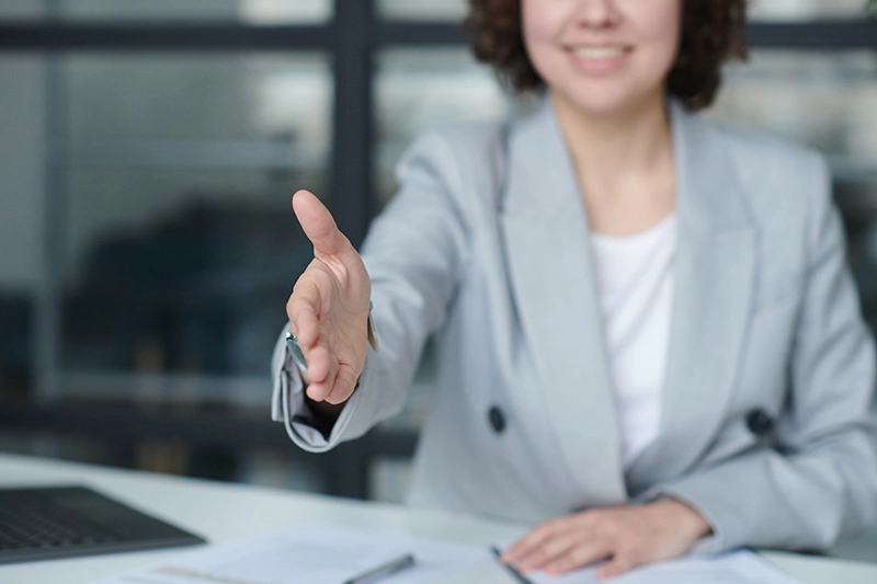 Professionals shaking hands — representing a bookkeeping referral partnership that supports the client while respecting each professional’s role.